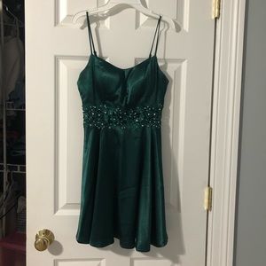 emerald green formal dress with flower detailing